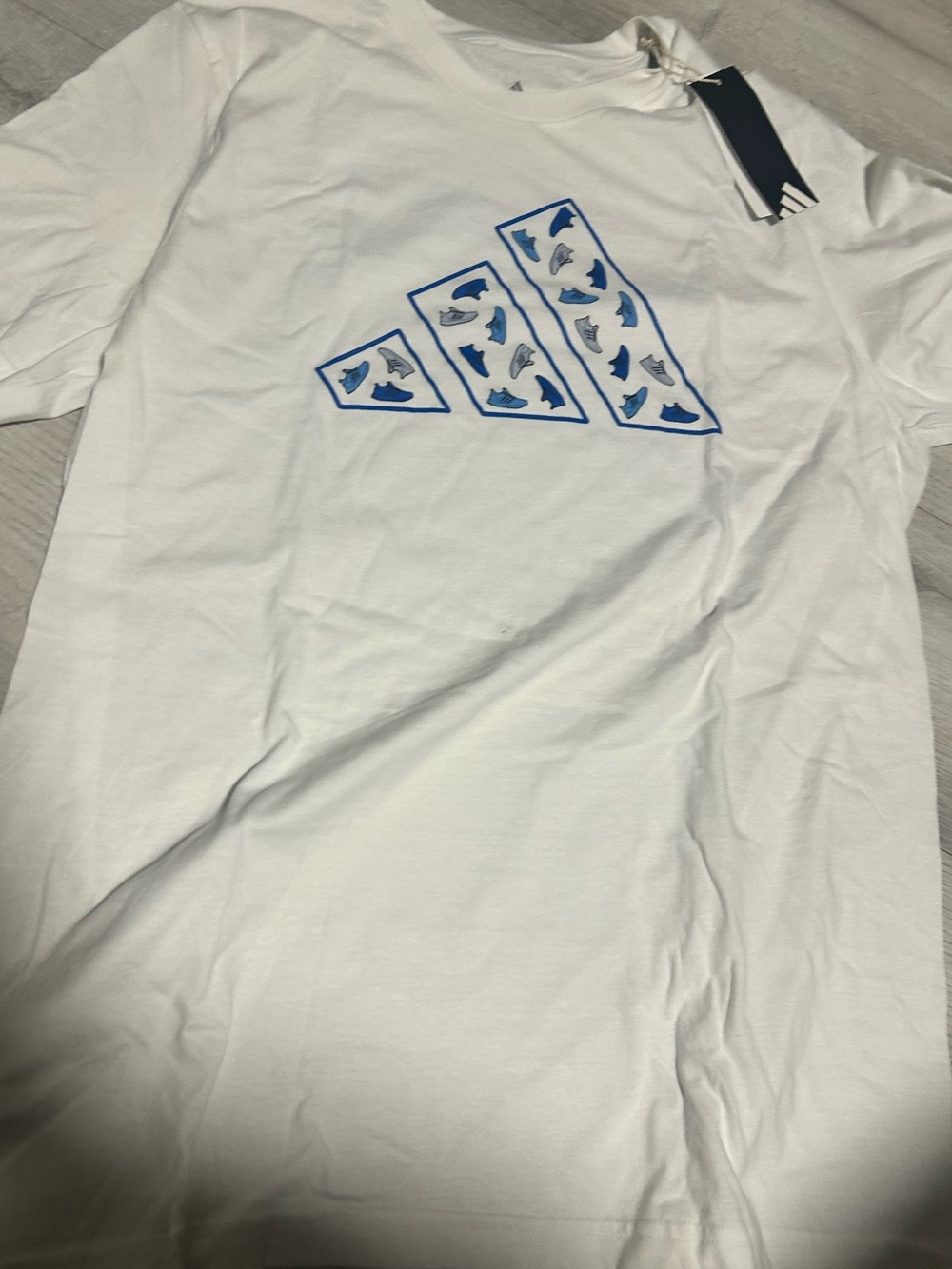 adidas White Tee with Blue Trefoil Outline and Pattern